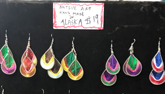 Earings with sign reading Native Art Hnad Made in Alaska $19