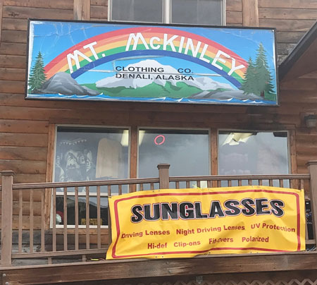 Storefront with a colorful sign reading Mt. McKinley Clothing Co. Denali, Alaska