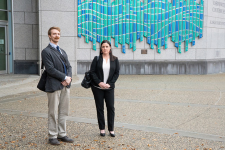 Assistant Attorney General Chris Darnall and Chief Assistant Attorney General Jenna Gruenstein stand outside of the courthouse