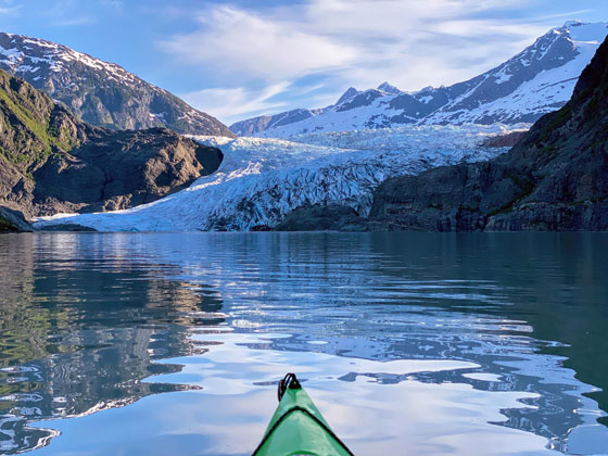 Mendenhall Glacier as seen from a kayak acreoss the water.